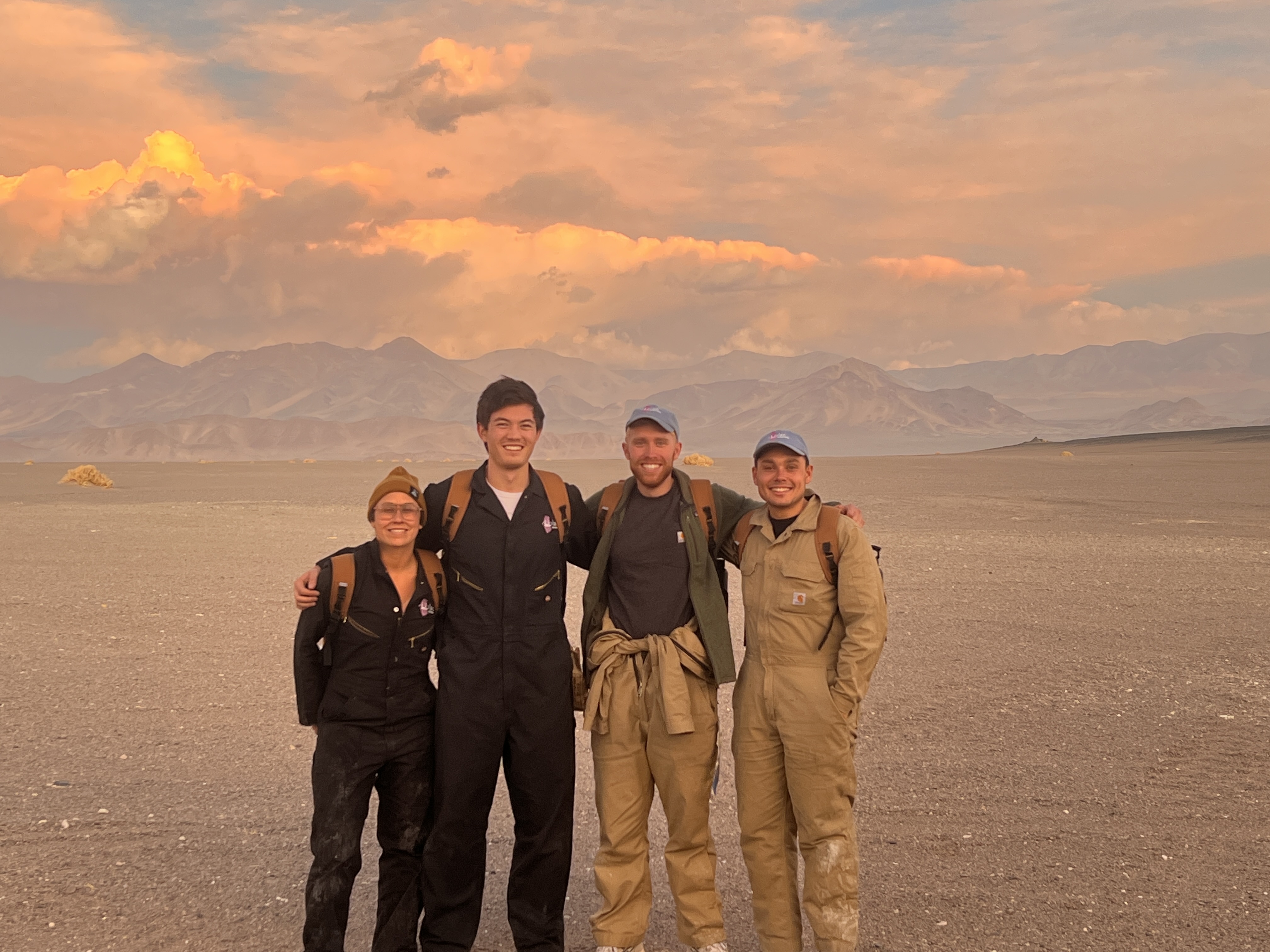 Field crew at a salar at sunset