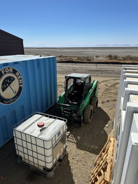 Operating a skid steer at a salt-flats site
